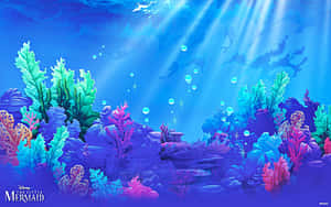 水下充滿活力的珊瑚礁，帶有陽光光束和漂浮的氣泡。 — 芭比美人魚 壁紙