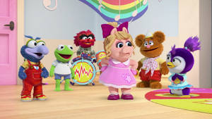 Muppet角色在色彩繽紛的兒童遊戲室演奏音樂。 — 妙妙熊仔 壁紙