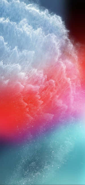 紅色、粉紅色和藍綠色的鮮豔宇宙塵埃爆炸。 — Galaxy A 壁紙