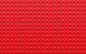 用於搭建的紅色LEGO底板，帶有凸點圖案。 — 樂高旋風忍者 壁紙