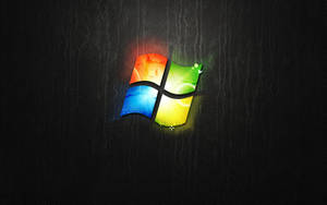 在深色皮革紋理上發光的Windows標誌 — 深色窗戶 壁紙
