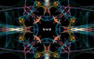 黑色背景上帶有「tool」文字的對稱霓虹光分形圖案。 — 美學音樂 壁紙