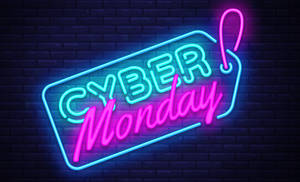 在磚牆上發光的霓虹燈Cyber Monday標誌 — 霓虹燈 壁紙