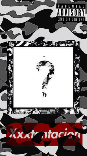 帶有迷彩圖案、帶框問號和紅色文字「xxxtentacion」的專輯封面。