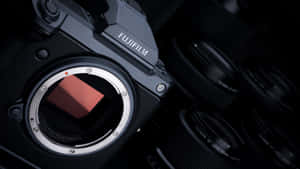 Fujifilm相機機身特寫，帶有鏡頭接環及周圍鏡頭。 — 背景 壁紙
