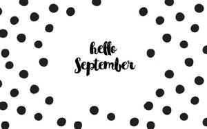 黑色圓點圍繞著白色背景上手寫的「hello September」。 — 九月 壁紙