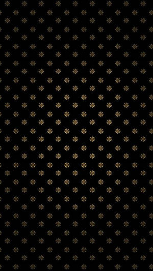 黑色背景配重複金色星爆圖案。 — 省電 壁紙