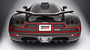 黑色碳纖維 Koenigsegg CCXR Edition 超級跑車後視圖，帶紅色點綴。 — 好看汽車 壁紙