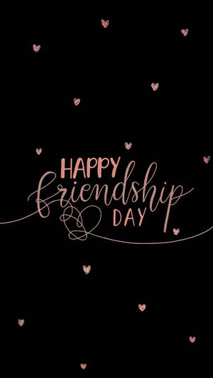 黑色背景上帶有玫瑰金愛心的Happy Friendship Day訊息。 — 省電 壁紙