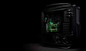 黑色電腦機殼，帶有綠色內部照明和 GeForce GTX 顯示卡。 — 酷炫遊戲 壁紙